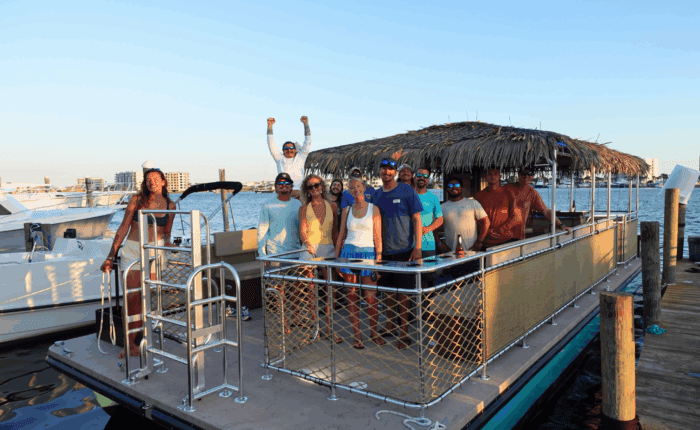 a group of people on the tipsy tiki boat